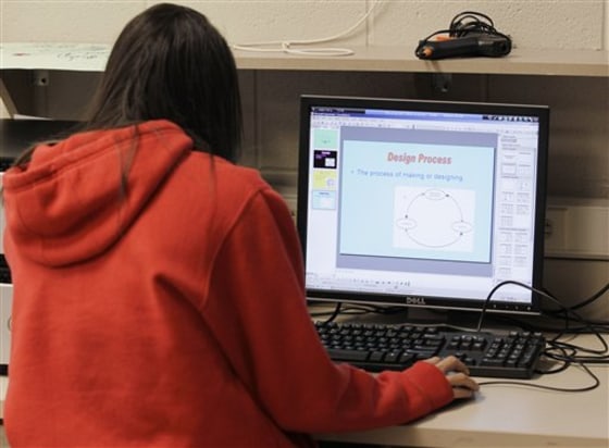 A student works on a project that will earn high school and college credits at Richmond High School in Richmond, Ind. Named a dropout factory in 2007, the school worked with parents and the county's leaders to create tutoring programs for struggling students.